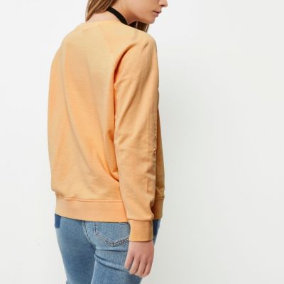 Light orange distressed sweatshirt